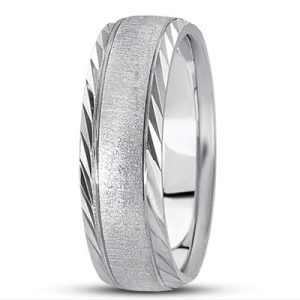 A silver wedding band with a brushed finish and diagonal engraved edges.