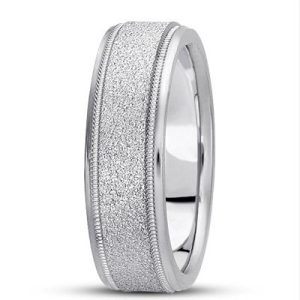 A silver wedding band with a textured finish and two polished grooves along its edges.