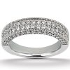 A silver ring features a band adorned with multiple sparkling gemstones along its surface.