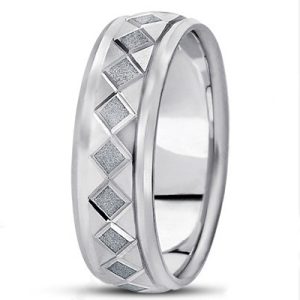 A silver ring features a pattern of textured diamond shapes around its band.