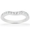 A silver ring with a wavy design is adorned with a row of small, clear gemstones.