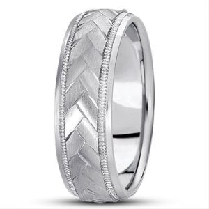 A silver wedding band featuring a braided pattern along its surface.