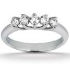 A silver ring with five clear stones set in a curved arrangement at the top.
