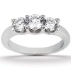 A silver three-stone ring featuring three round, clear gemstones set in a sleek band.