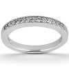 A silver ring adorned with small, sparkling stones is displayed against a plain background.