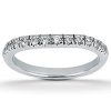 A silver band ring set with multiple small, clear diamonds.