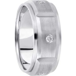 A silver wedding band with a brushed finish features two small diamonds set into its surface.