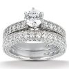 A silver engagement ring set featuring a large central diamond surrounded by smaller diamonds.
