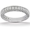 A silver ring with a row of sparkling clear gemstones set along its surface.