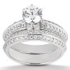 A silver engagement ring set with a large central diamond and smaller diamonds along the band.