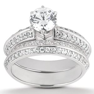A silver engagement ring set with a large central diamond and smaller diamonds along the band.