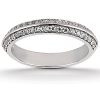 A silver ring features two rows of small, sparkling gemstones along its band.