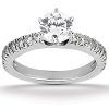 A silver ring featuring a large central diamond surrounded by smaller diamonds on the band.