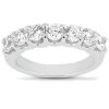 A silver band ring set with multiple clear gemstones arranged in a row.