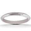 A shiny silver ring is positioned flat on a white surface.