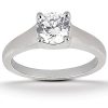 A silver engagement ring with a prominent round diamond setting.