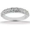 A silver ring adorned with small diamonds in a leaf pattern.