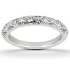 A silver ring featuring a decorative pattern with small diamond-like stones.