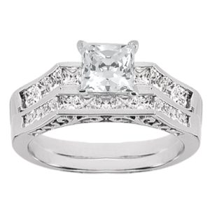 A silver engagement ring features a large square diamond centerpiece surrounded by smaller round diamonds.