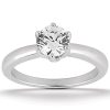 A silver engagement ring featuring a large round diamond as the main gemstone.