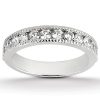 A silver ring adorned with multiple round, clear gemstones set in a row along its band.