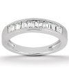 A silver band ring featuring a row of rectangular clear gemstones along the top edge.