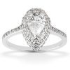 A silver ring features a pear-shaped diamond at the center, surrounded by smaller diamonds along the band.