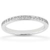 A thin, silver ring with a row of small clear stones set into its surface is displayed against a light background.