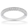 A silver ring is displayed, featuring a row of small gemstones set along the top surface.