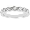 A silver ring featuring a pattern of alternating teardrop shapes with small diamonds set in each.