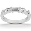 A silver ring features three round and two rectangular clear gemstones set in a row.