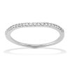 A thin silver band ring is displayed, featuring a row of small clear gemstones along the top edge.