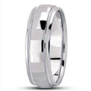 A shiny silver wedding band with a polished surface and subtle decorative edges.