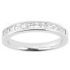 A silver band ring with a row of clear, triangular-cut stones set along the top.