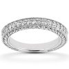 A silver ring adorned with sparkling clear gemstones is displayed on a plain background.