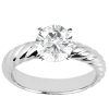 A silver twisted band ring features a large, round, sparkling diamond prominently set in the center.