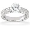 A silver engagement ring with a large round diamond is displayed prominently against a white background.