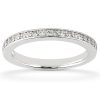 A thin silver ring with a row of clear gemstones embedded along its band.