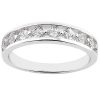 Silver ring with a row of clear, faceted gemstones along the band.