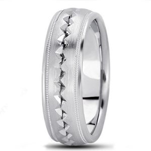 A silver ring with a textured band featuring a line of raised triangular shapes along the center.