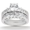 A silver ring set featuring a large central diamond surrounded by smaller diamonds in a stacked design.