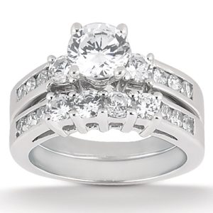 A silver ring set featuring a large central diamond surrounded by smaller diamonds in a stacked design.