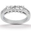 A silver ring features multiple round diamonds set in a row across the top.