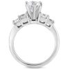 A silver engagement ring featuring a central round diamond surrounded by four smaller stones.