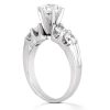 Silver engagement ring featuring a large central diamond and smaller stones on the band.