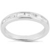 A silver ring features a row of rectangular, clear stones set along its band.