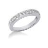 A silver ring adorned with a line of sparkling clear gemstones.