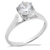 A silver ring with a large, clear gemstone is displayed prominently.