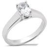 An oval-cut diamond is set in a white gold engagement ring.