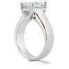 A silver ring features a large, rectangular gemstone set in a pronged mounting.